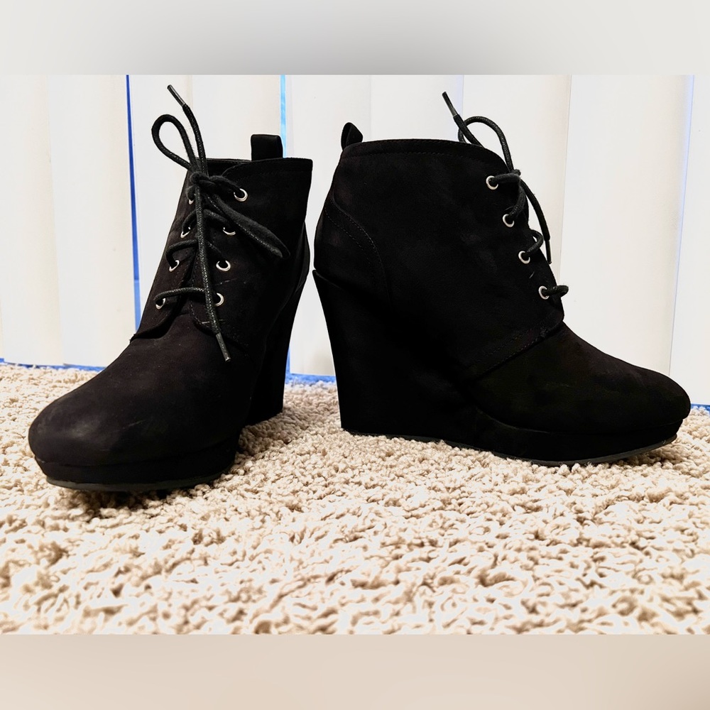 Women’s black suede winter wedge dress bootie.